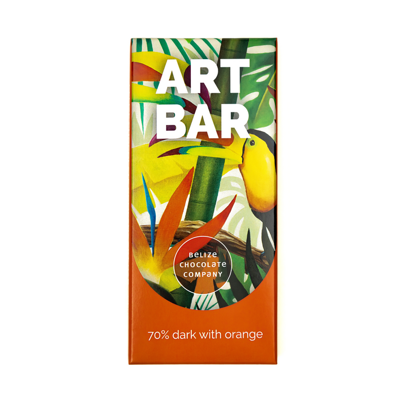 A visually appealing packaging featuring Belizean artwork, including a Belizean rainforest jungle scene by Chuy. This packaging promotes creativity, empathy, and support for Belizean school children. It describes the process of making a 70% dark chocolate bar from organic Belizean cacao beans and Orange Walk cane sugar, with tasting notes of citrus and chocolate